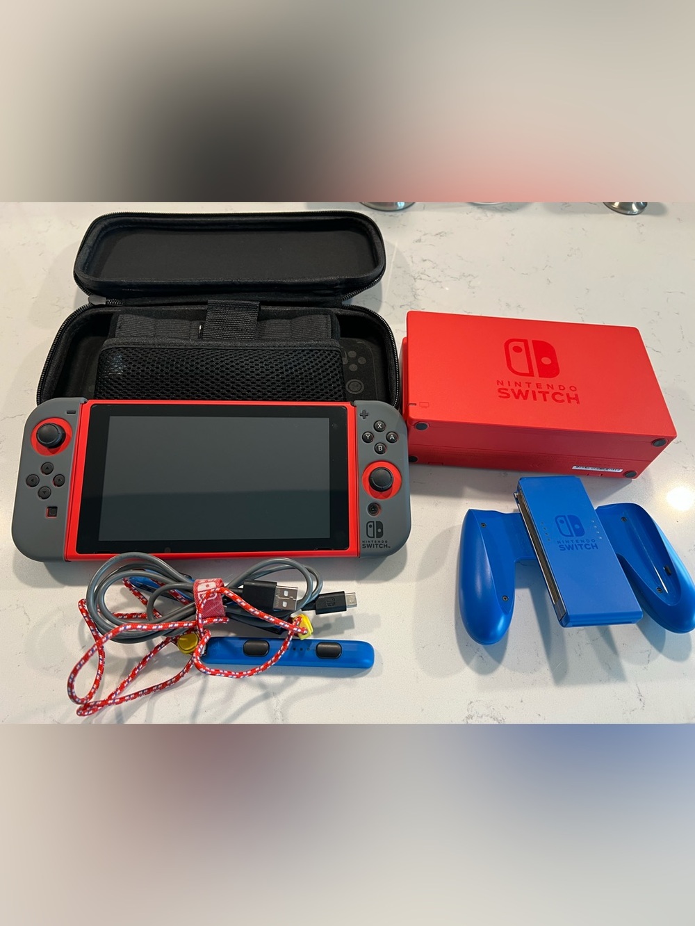 Nintendo Switch with docking station, wrist straps, charging cable, case